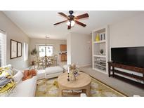 Open-concept living room with view of dining area and kitchen at 6657 E Regina St, Mesa, AZ 85215