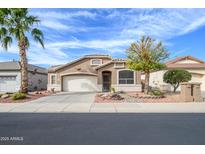 Charming single-story home featuring desert landscaping, a two-car garage, and a well-maintained front yard at 17202 N Javelina Dr, Surprise, AZ 85374