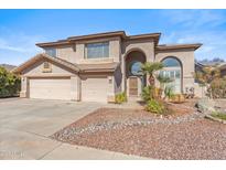Two-story house with a three-car garage and landscaped front yard at 2380 W Megan St, Chandler, AZ 85224