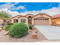 Single-story home with desert landscaping and two-car garage at 37110 W Leonessa Ave, Maricopa, AZ 85138