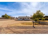 Single story home with a large yard at 521 E Lehi Rd, Mesa, AZ 85203