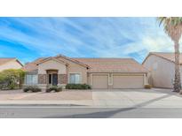 Charming single-story home featuring a three car garage and a xeriscaped front yard for low maintenance at 9441 E Juanita Ave, Mesa, AZ 85209