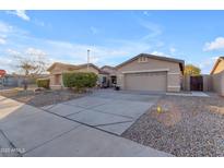 Single-story home with two-car garage, landscaping, and a paved driveway at 21187 E Alyssa Rd, Queen Creek, AZ 85142