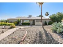 Charming single-story home with a desert landscaped front yard and inviting walkway at 2343 E Cholla St, Phoenix, AZ 85028