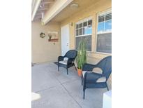 Inviting front porch with wicker chairs and potted plants at 2929 E Broadway Rd # 44, Mesa, AZ 85204