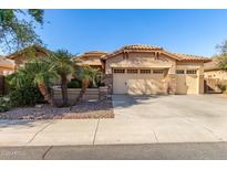 Single-story home with a two-car garage and nicely landscaped front yard at 4350 S Hudson Pl, Chandler, AZ 85249
