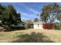 Ranch style home with red tile roof, mature landscaping, and a spacious yard at 1120 W Ivanhoe St, Chandler, AZ 85224