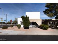 Mid-century modern home with clean lines and desert landscaping at 1850 W Stella Ln, Phoenix, AZ 85015