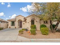 One-story house with desert landscaping and a two-car garage at 21056 E Avenida Del Valle --, Queen Creek, AZ 85142