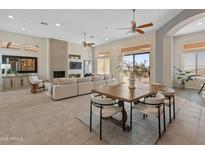 Bright dining area with wood table and modern chairs at 2207 W Camargo Dr, Anthem, AZ 85086