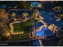 Luxury home with pool, putting green, and tennis court at 6127 E Mescal St, Scottsdale, AZ 85254