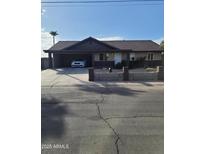Ranch style home with carport and block wall at 887 E Detroit St, Chandler, AZ 85225