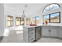 Modern kitchen with stainless steel appliances and an island at 9544 W Sierra Pinta Dr, Peoria, AZ 85382