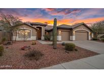 Beautiful desert landscaping surrounds this single-story home with a two-car garage at 26803 N 45Th Pl, Cave Creek, AZ 85331