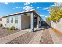 Stylish exterior of the home featuring a well-maintained yard and inviting entryway at 1618 W Culver St, Phoenix, AZ 85007