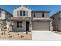 Charming two-story home featuring a covered porch, a two-car garage, and low-maintenance landscaping at 22831 N 183Rd Dr, Surprise, AZ 85387