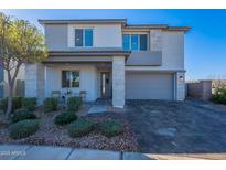 Two-story home with gray exterior, landscaped yard, and two-car garage at 22633 E Domingo Rd, Queen Creek, AZ 85142