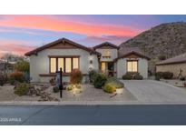 Single-story home with desert landscaping, two-car garage, and mountain views at 31538 N Larkspur Dr, San Tan Valley, AZ 85143