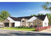 Stunning modern home with a two-car garage and landscaped front yard at 3832 E Highland Ave, Phoenix, AZ 85018