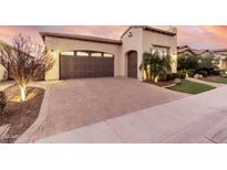 Single-story home with a two-car garage and attractive landscaping at 1175 E Copper Holw, Queen Creek, AZ 85140