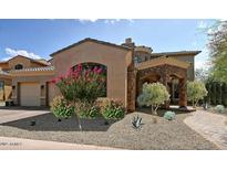 Stunning two-story home with stone accents and landscaped front yard at 3804 E Camelback Rd, Phoenix, AZ 85018