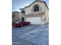 Two-story house with attached garage and driveway at 1340 S 232Nd Ave, Buckeye, AZ 85326