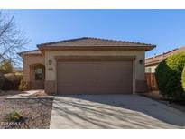 One-story house with brown garage door and landscaping at 2331 W Kristina Ave, San Tan Valley, AZ 85144