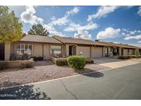 Cute condo exterior, nicely landscaped with a spacious driveway and a charming front patio at 520 S Greenfield Rd # 20, Mesa, AZ 85206