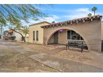 Front view of a charming single story home with arched entryway at 526 N Hobson Plz, Mesa, AZ 85203