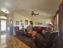 Living room with hardwood floors, comfortable seating, and ceiling fan at 650 N Hawes Rd # 4820, Mesa, AZ 85207