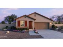 One-story home with red accents and landscaped front yard at 15781 W Hackamore Dr, Surprise, AZ 85387