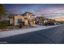 Street view of upscale neighborhood with similar homes at 17673 W Agave Rd, Goodyear, AZ 85338