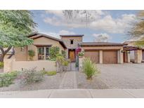 Stunning Spanish-style home with attractive landscaping and a gated entry at 17918 N 95Th St, Scottsdale, AZ 85255