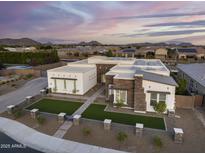 Luxury home with solar panels, spacious yard, and modern design, in a Gathering-friendly neighborhood at 23311 N 95Th Dr, Peoria, AZ 85383