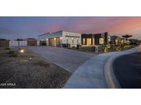 Modern home exterior, featuring a combination of stucco and stone at 23311 N 95Th Dr, Peoria, AZ 85383