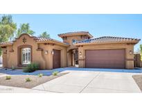 Beautiful two-story home with a three-car garage and desert landscaping at 1807 W Sierra Sunset Trl, Phoenix, AZ 85085