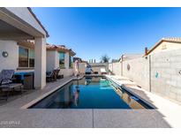 Relaxing pool area with patio furniture and a covered patio at 18254 W Via Montoya Dr, Surprise, AZ 85387