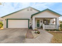 Charming single-story home with a green trimmed roof and a two-car garage at 2207 W Hayward Ave, Phoenix, AZ 85021