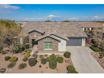 Single-story home with stone accents and landscaped yard at 2480 E Haymore St, Gilbert, AZ 85298