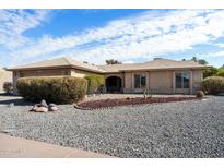 Single-story home with landscaped front yard and gravel driveway at 1505 Leisure World --, Mesa, AZ 85206