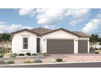 Single-story home with two-car garage and desert landscaping at 18240 W Hess St, Goodyear, AZ 85338