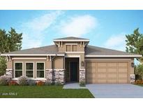 Single-story home with stone accents and a 3-car garage at 21569 W Pierson St, Buckeye, AZ 85396