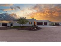 Stunning desert contemporary home with a three-car garage and landscaped front yard at 2809 W Paso Nuevo Dr, Phoenix, AZ 85086