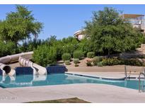 Resort-style pool with waterslides and a relaxing atmosphere at 322 S San Fernando Ln, Casa Grande, AZ 85194