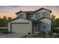 Two-story home with gray siding, three-car garage, and landscaping at 4120 E Ghost Flower Ln, San Tan Valley, AZ 85140