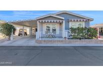 Attractive exterior of a manufactured home with carport and landscaping at 650 N Hawes Rd # 3811, Mesa, AZ 85207