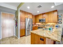 Modern kitchen with stainless steel appliances and granite countertops at 7127 E Rancho Vista Dr # 5009, Scottsdale, AZ 85251