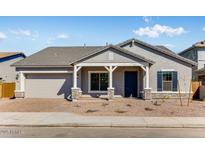 Charming single-story home featuring neutral paint, stylish stone accents, and a covered porch at 8432 W Solano Dr, Glendale, AZ 85305