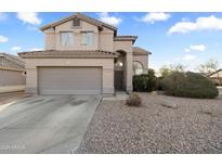 Charming two-story home with a well-maintained front yard and a two car garage at 934 S Bristol Dr, Mesa, AZ 85208