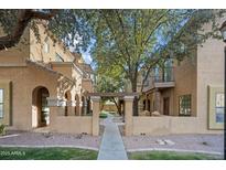 Townhouse exterior with courtyard and walkway at 1702 E Bell Rd # 130, Phoenix, AZ 85022